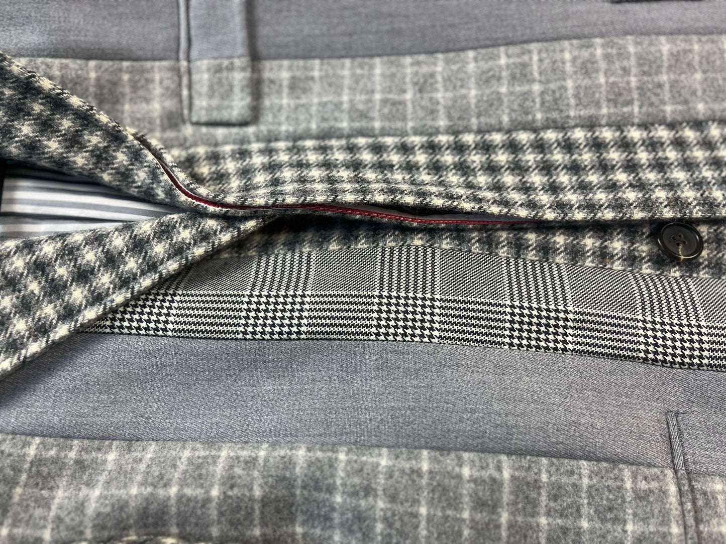Curly astrakhan lamb fur collar on Thom Browne Fun Mix overcoat