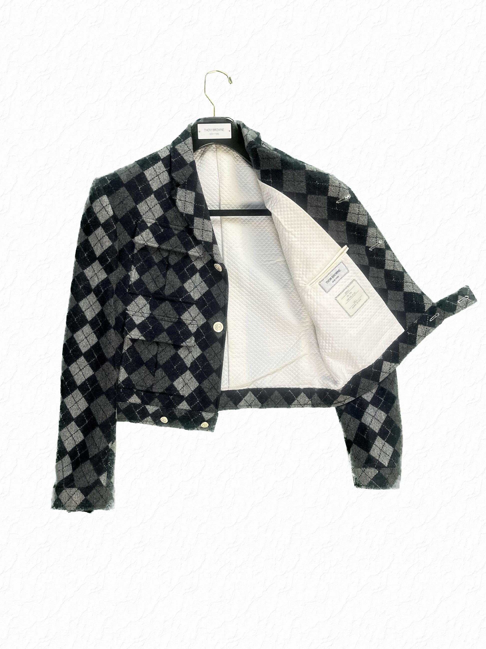 Grey and navy argyle cashmere Thom Browne cropped jacket with quilted cream lining