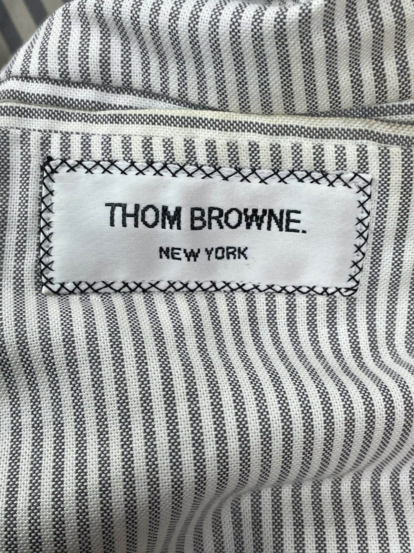Thom Browne New York woven label on camel hair car coat