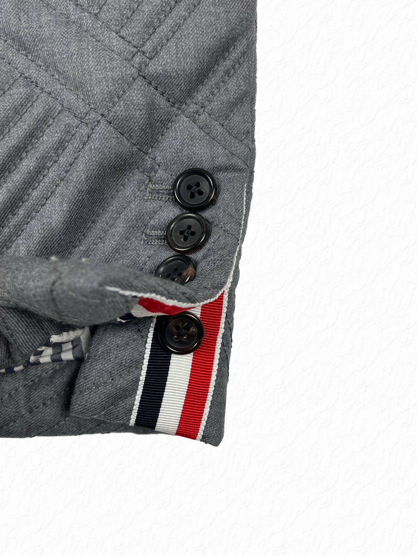 Diamond quilted grey wool blazer by Thom Browne