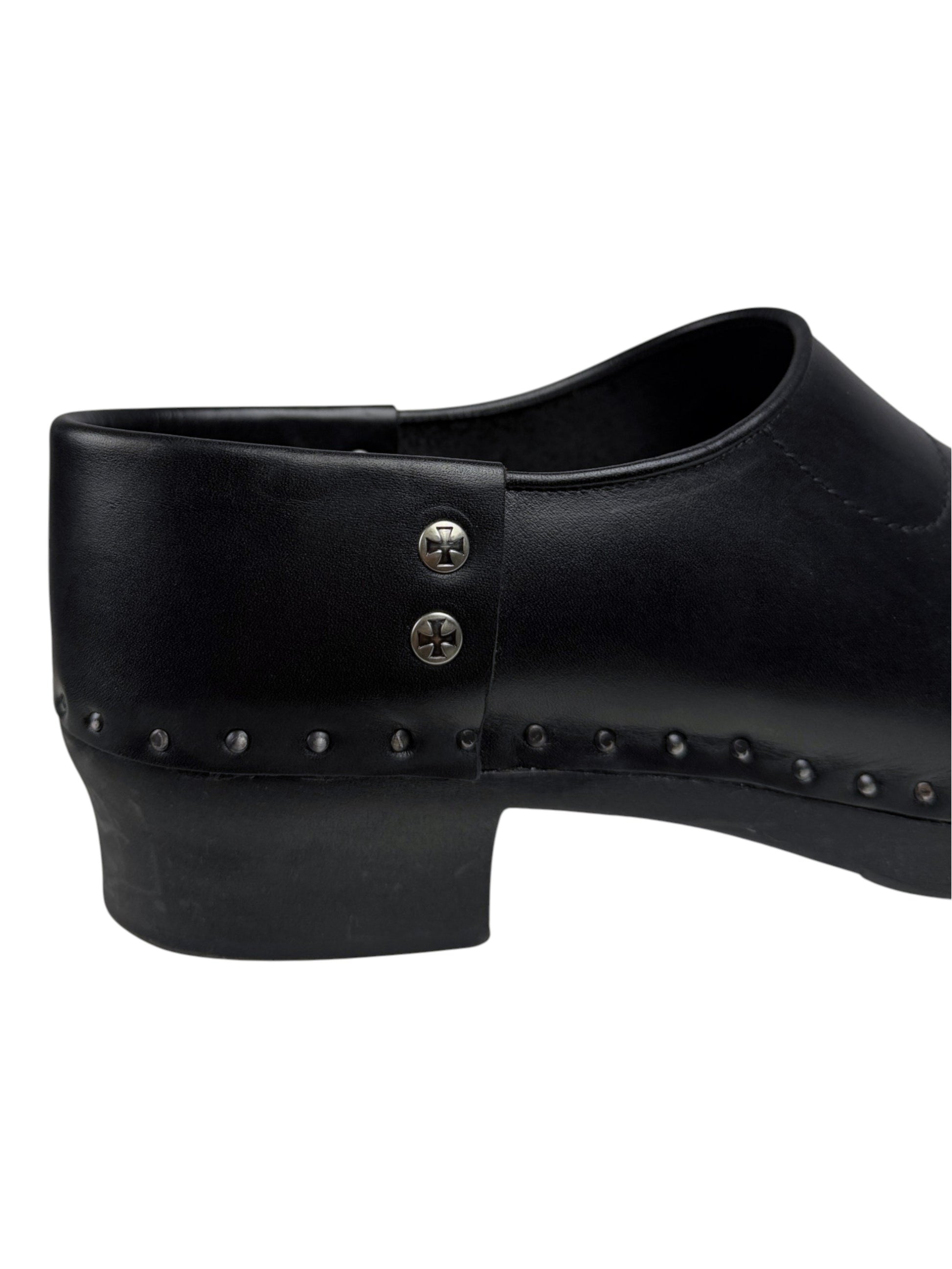 Iron cross stud buttons on heel counter of Enfants Riches Déprimés leather clog mules