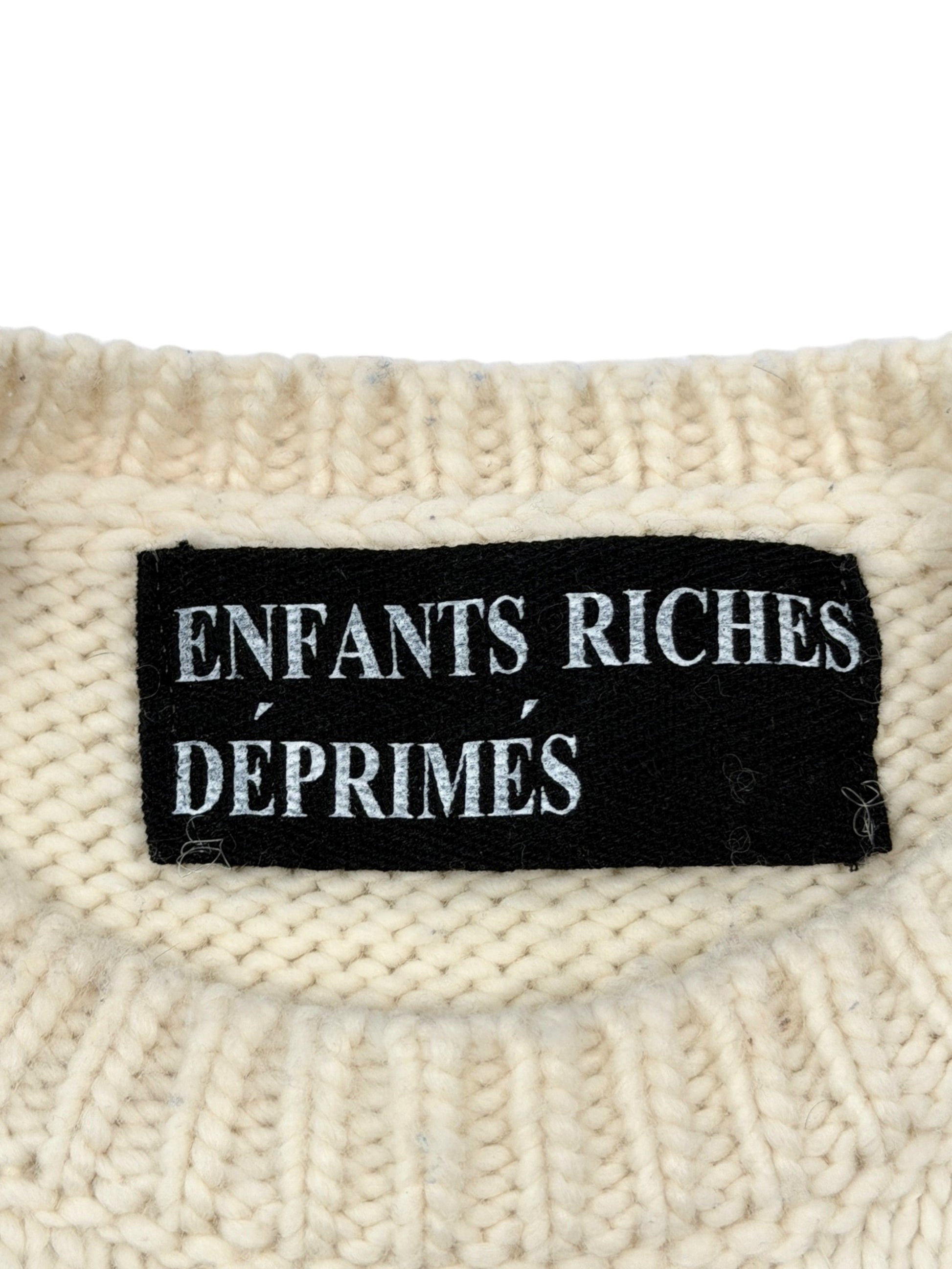 Cream merino wool knit ERD sweater with woven Enfants Riches Déprimés label