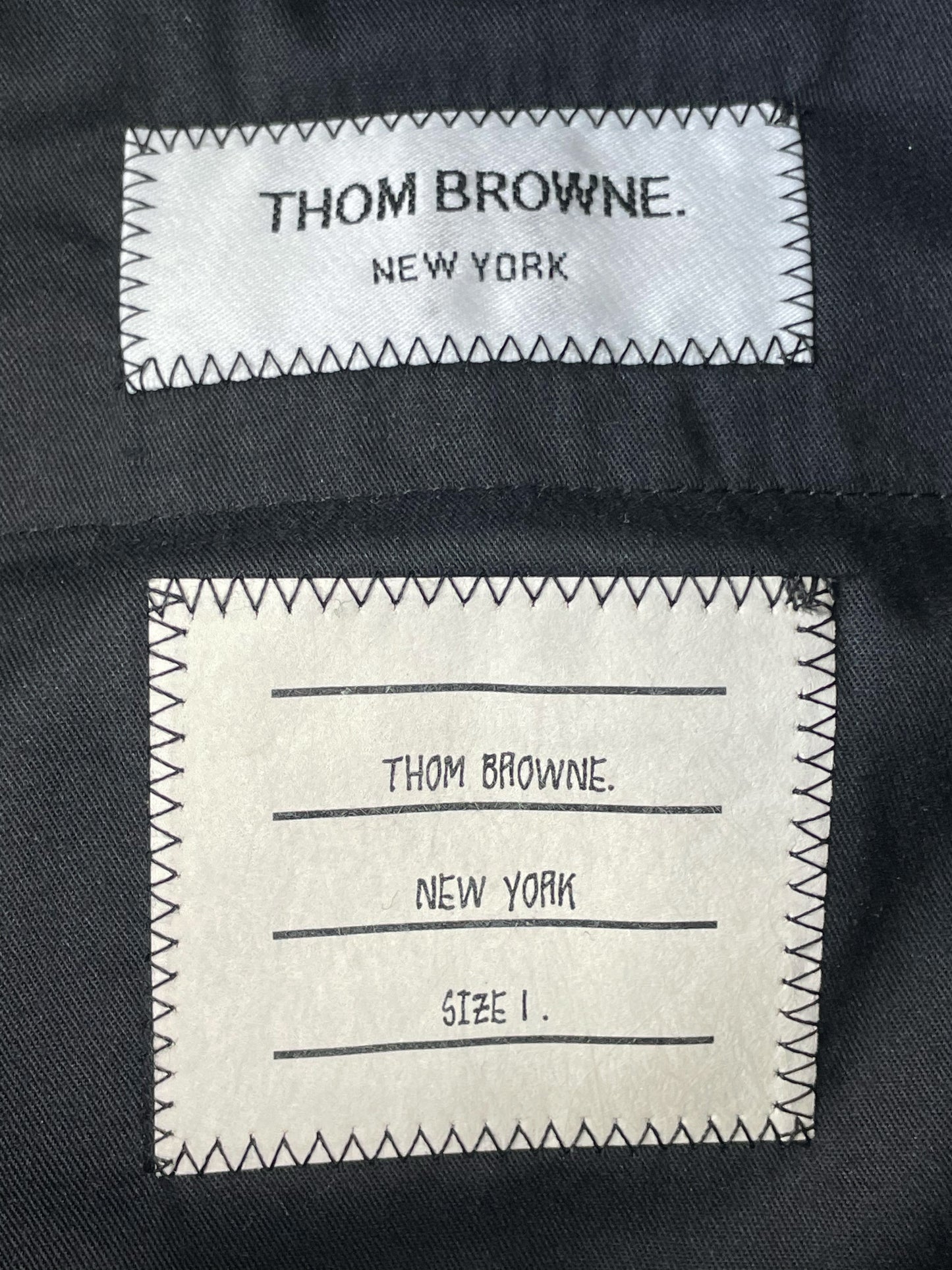 Thom Browne trousers with red white blue grosgrain tab
