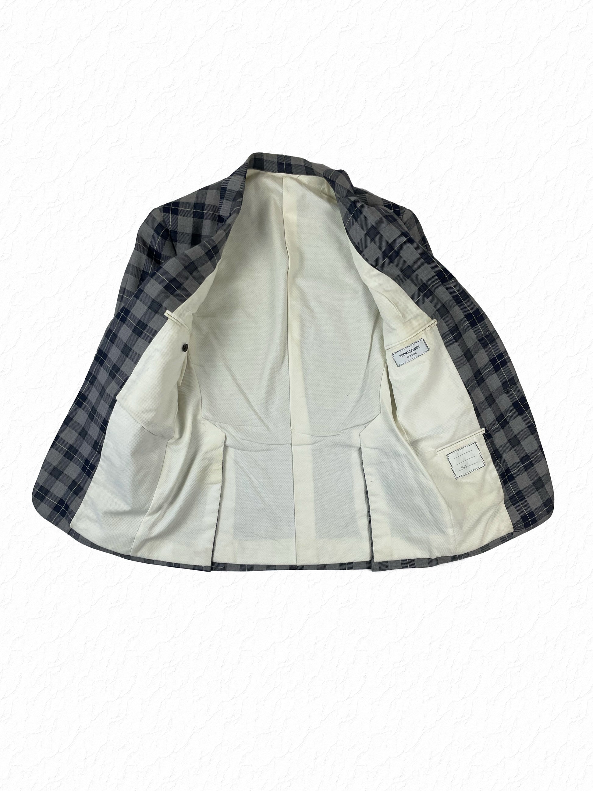 Navy and grey check Thom Browne wool blazer with four-button working cuffs