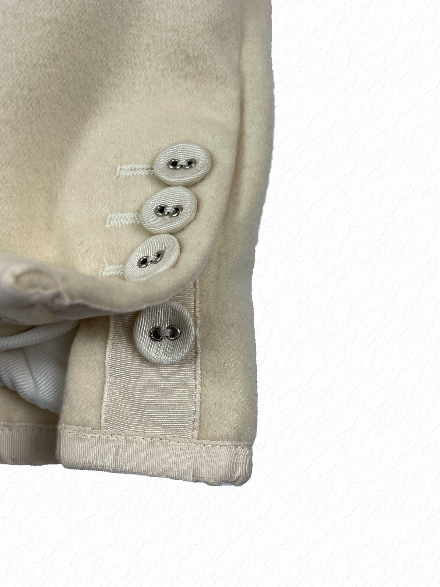 Cashmere blazer cuff with white grosgrain trim and mother of pearl buttons Thom Browne