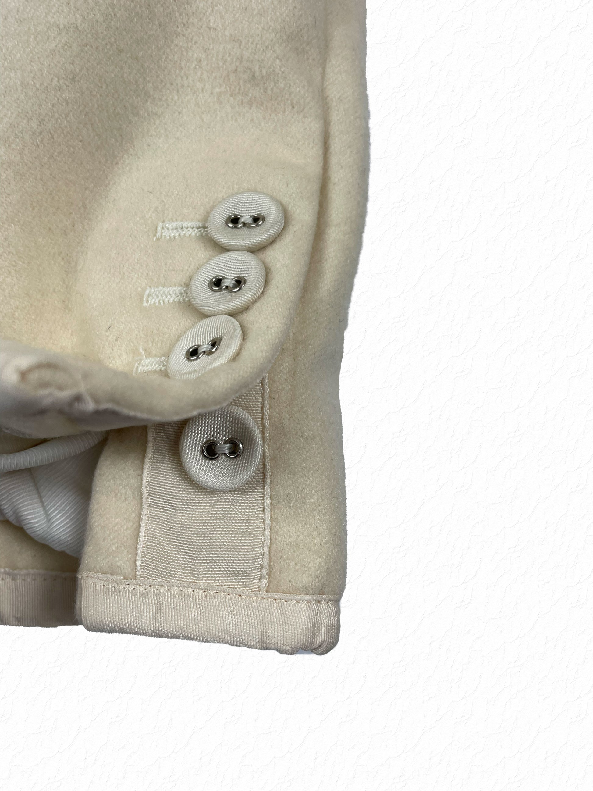 Cashmere blazer cuff with white grosgrain trim and mother of pearl buttons Thom Browne