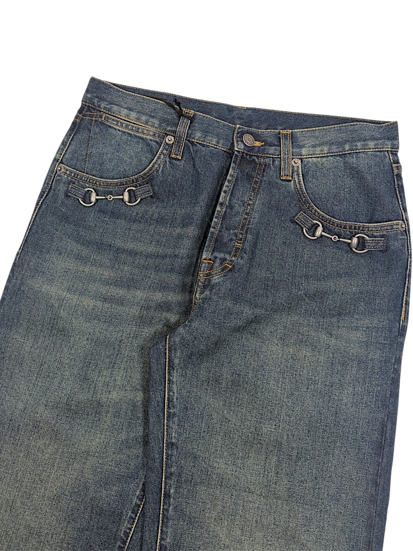 Silver horsebit hardware on Gucci front pocket denim