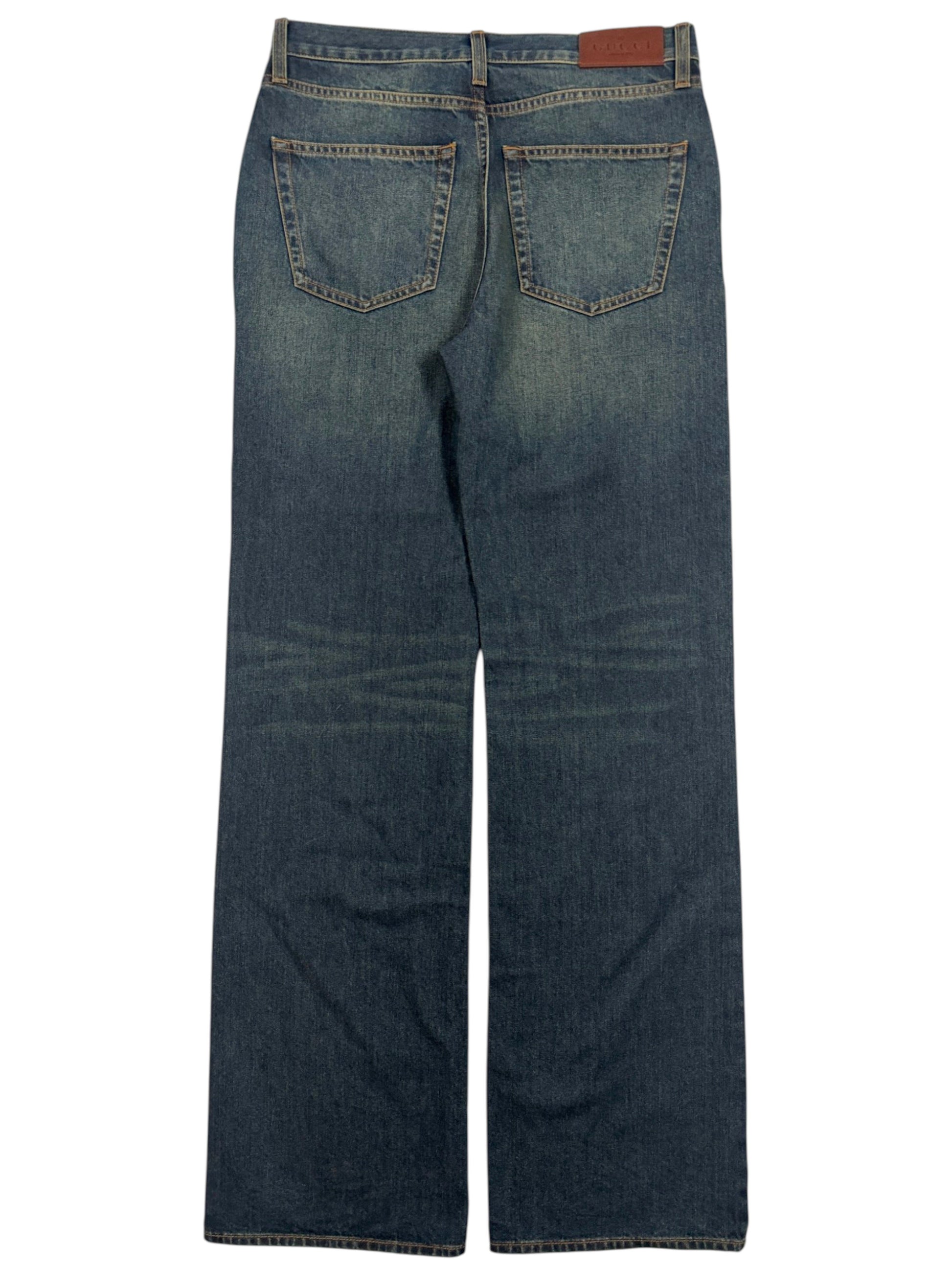 Gucci bootcut denim jeans with faded blue wash and stitched pockets