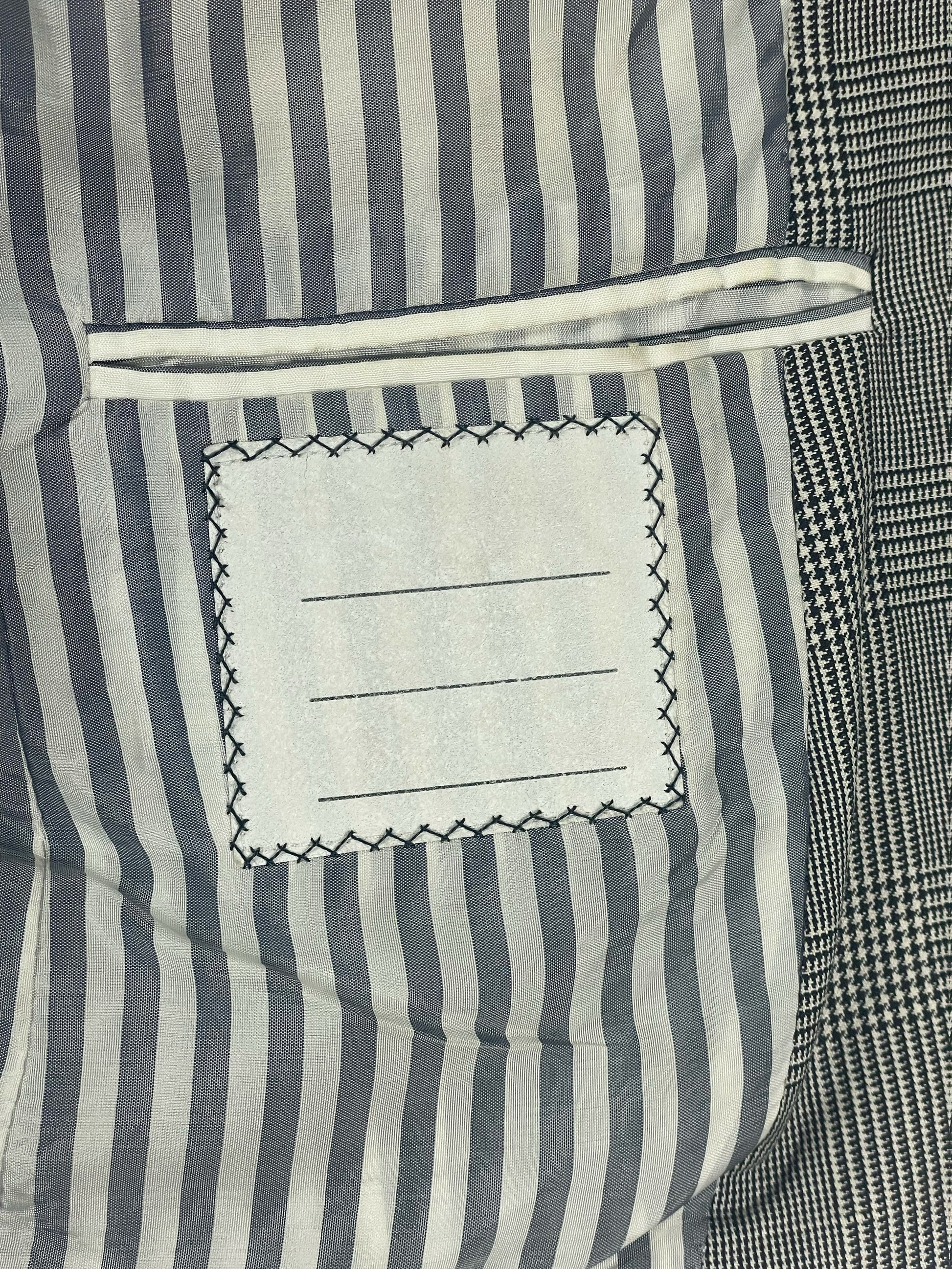 Signature RWB grosgrain trim on Thom Browne glen plaid blazer