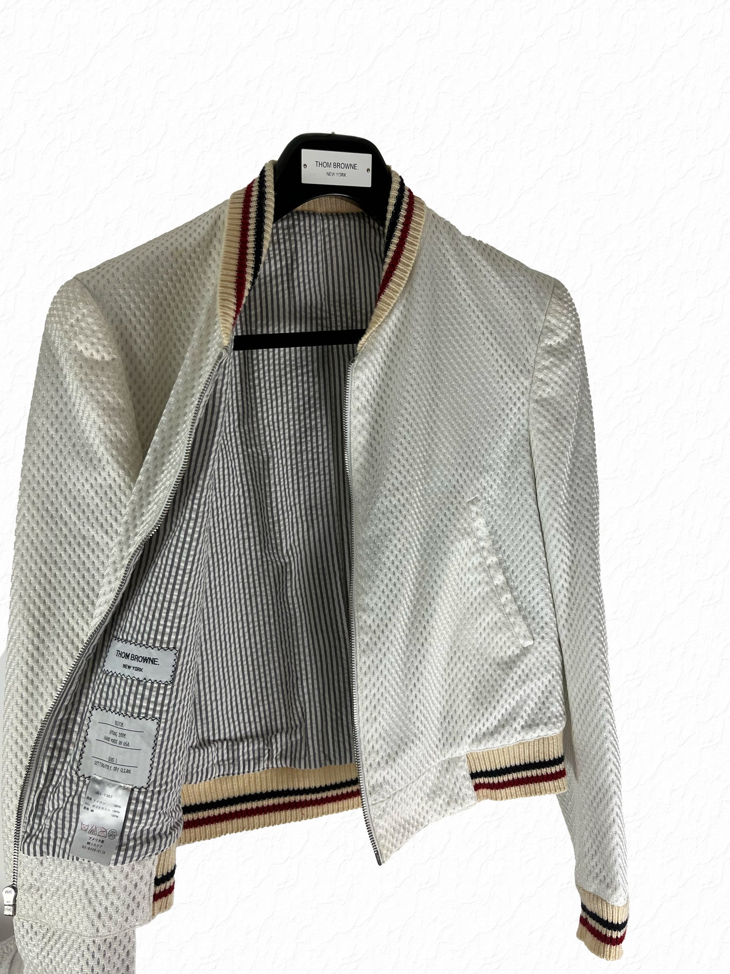 Thom Browne striped seersucker lining with red white blue grosgrain ribbing