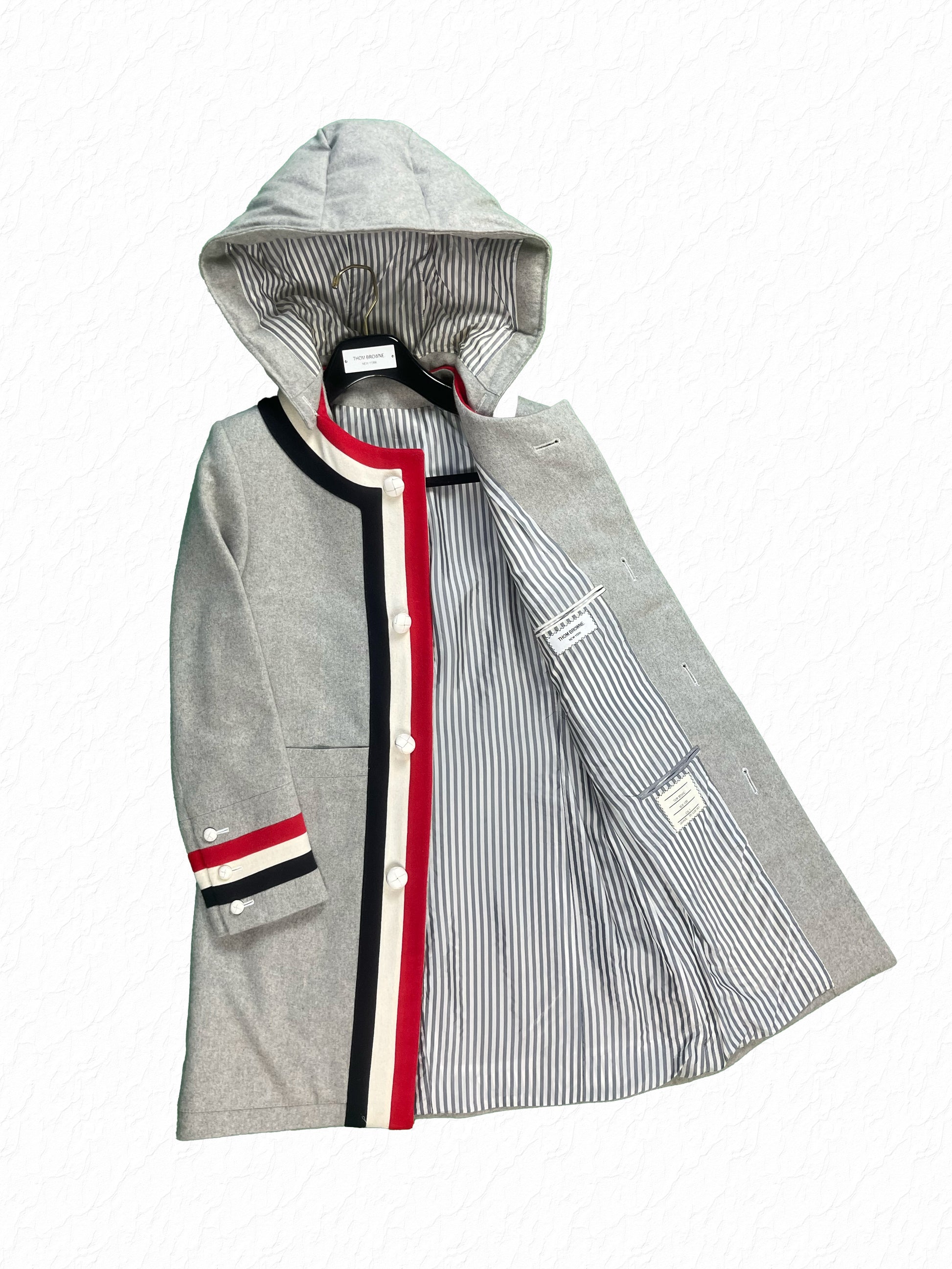 Grey cashmere Thom Browne hooded coat with white leather ball buttons