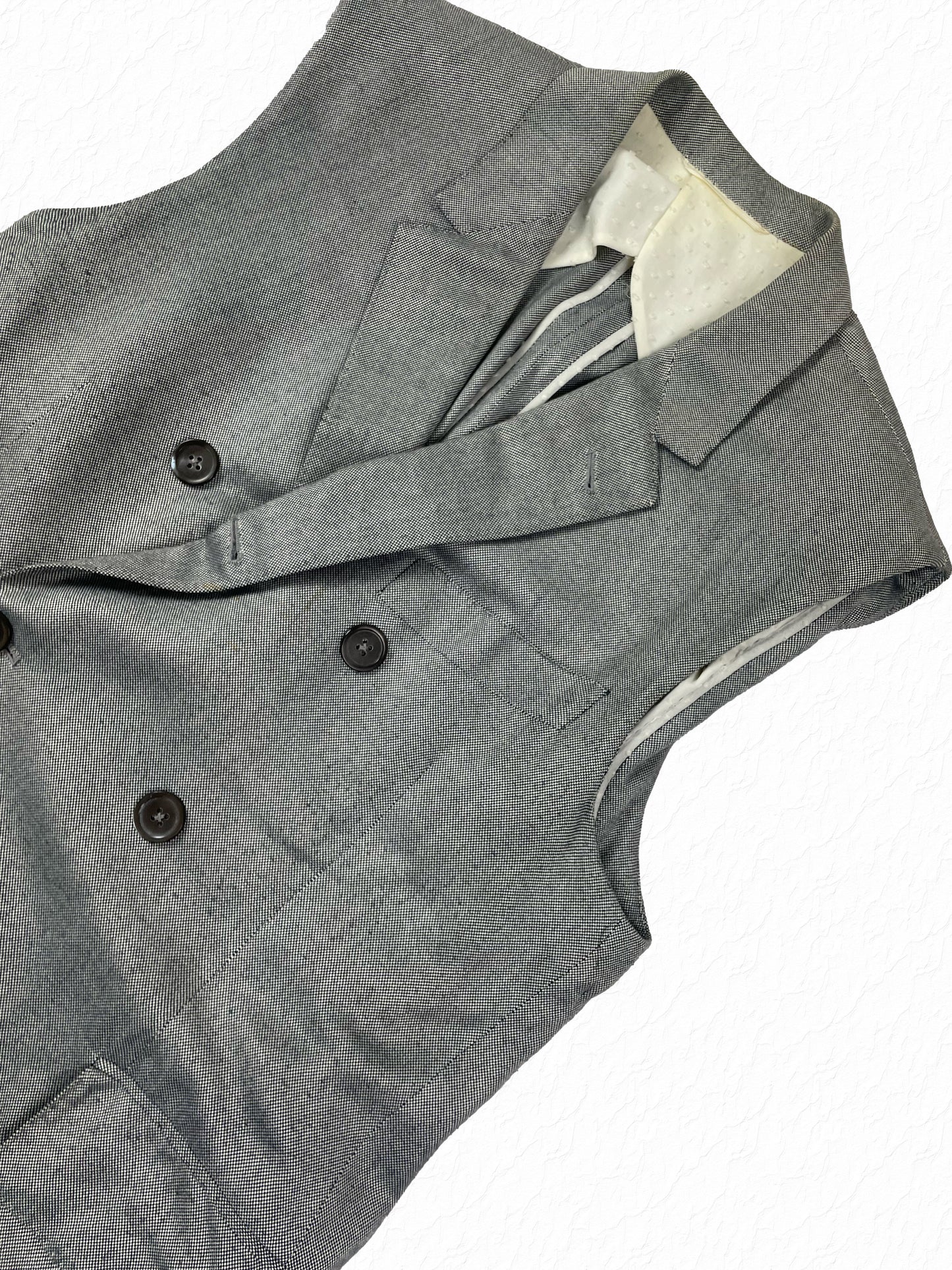 Black and white pepper cotton Thom Browne sleeveless chesterfield with peak lapels