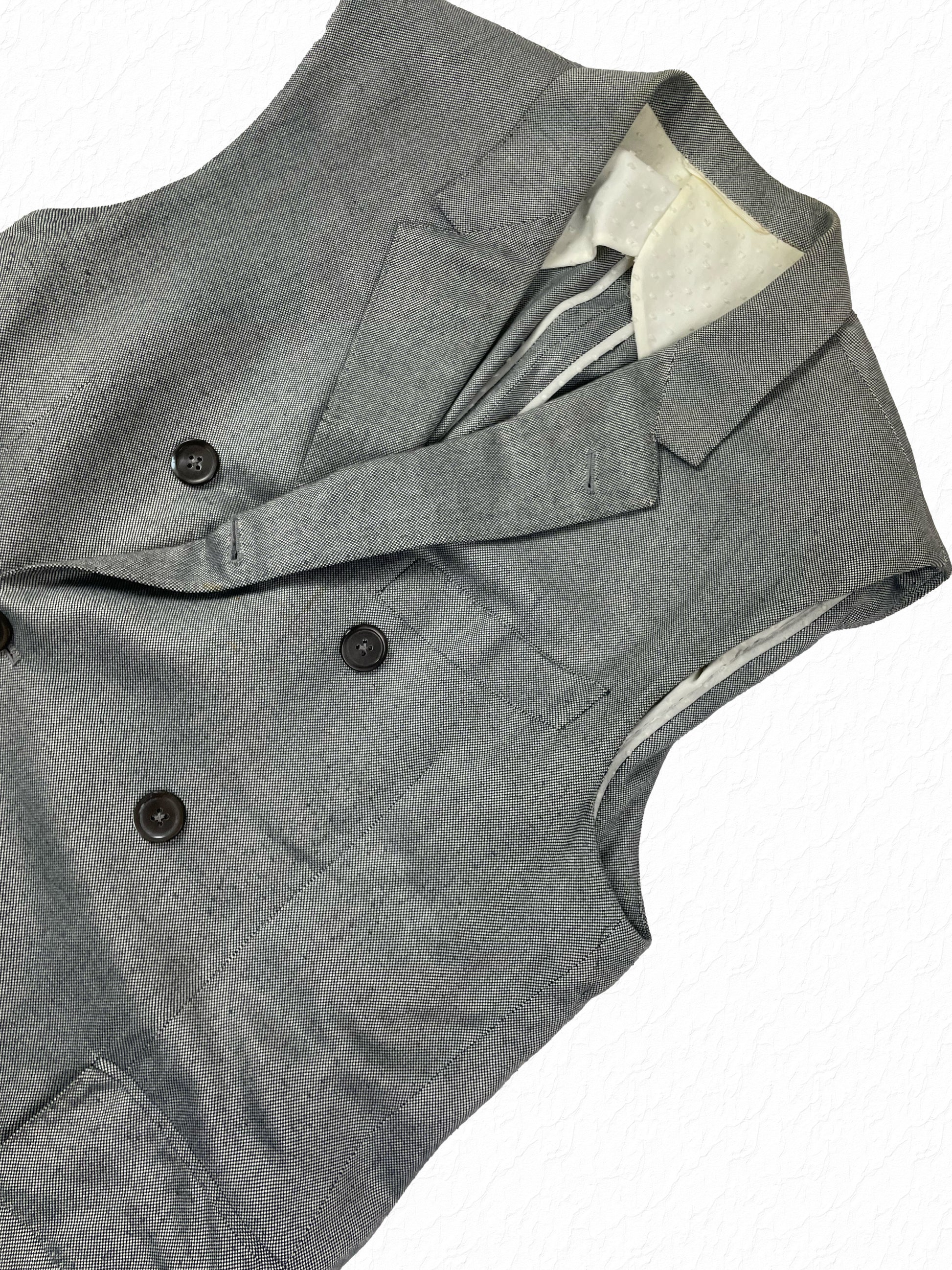 Black and white pepper cotton Thom Browne sleeveless chesterfield with peak lapels