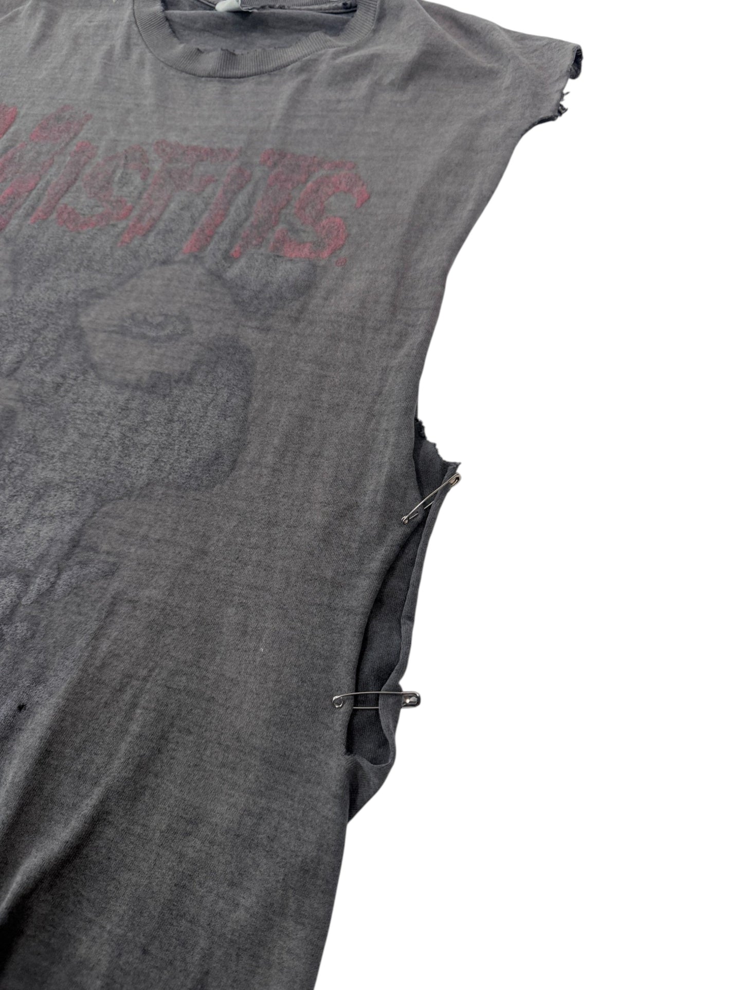 Distressed Misfits punk tee with open sides held by safety pins