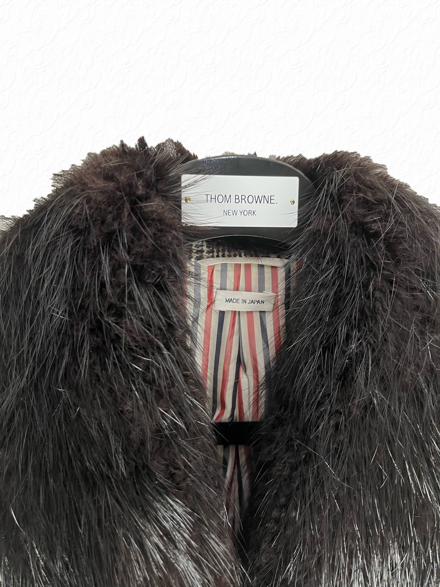 Black beaver fur collar on Thom Browne wool glen plaid overcoat