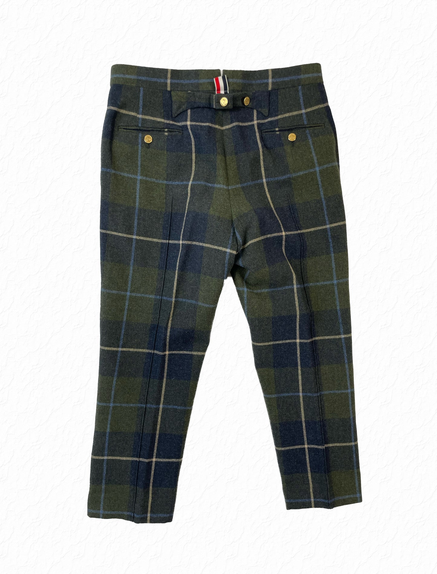 Anchor button ankle fly on Thom Browne tartan plaid wool trousers