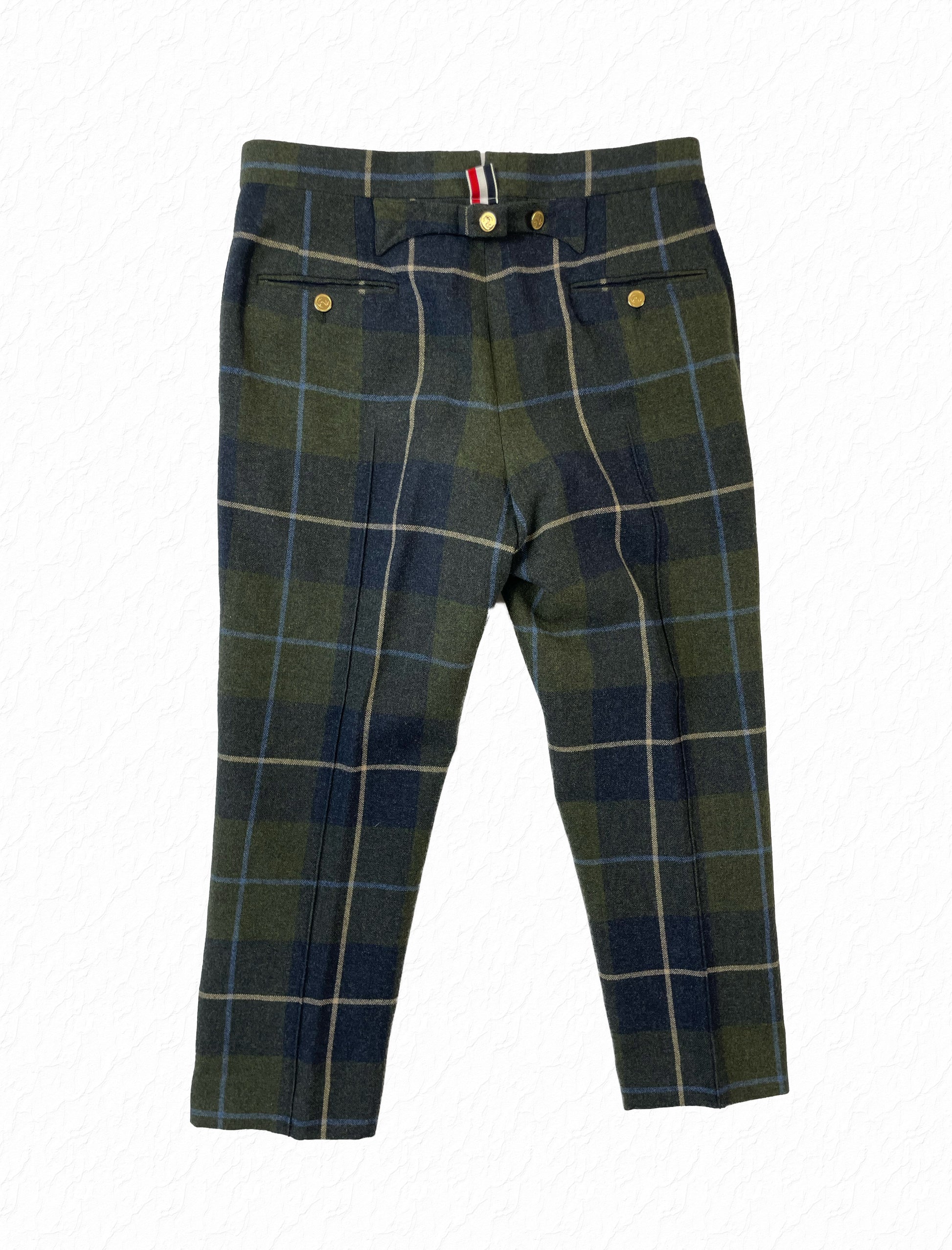 Anchor button ankle fly on Thom Browne tartan plaid wool trousers