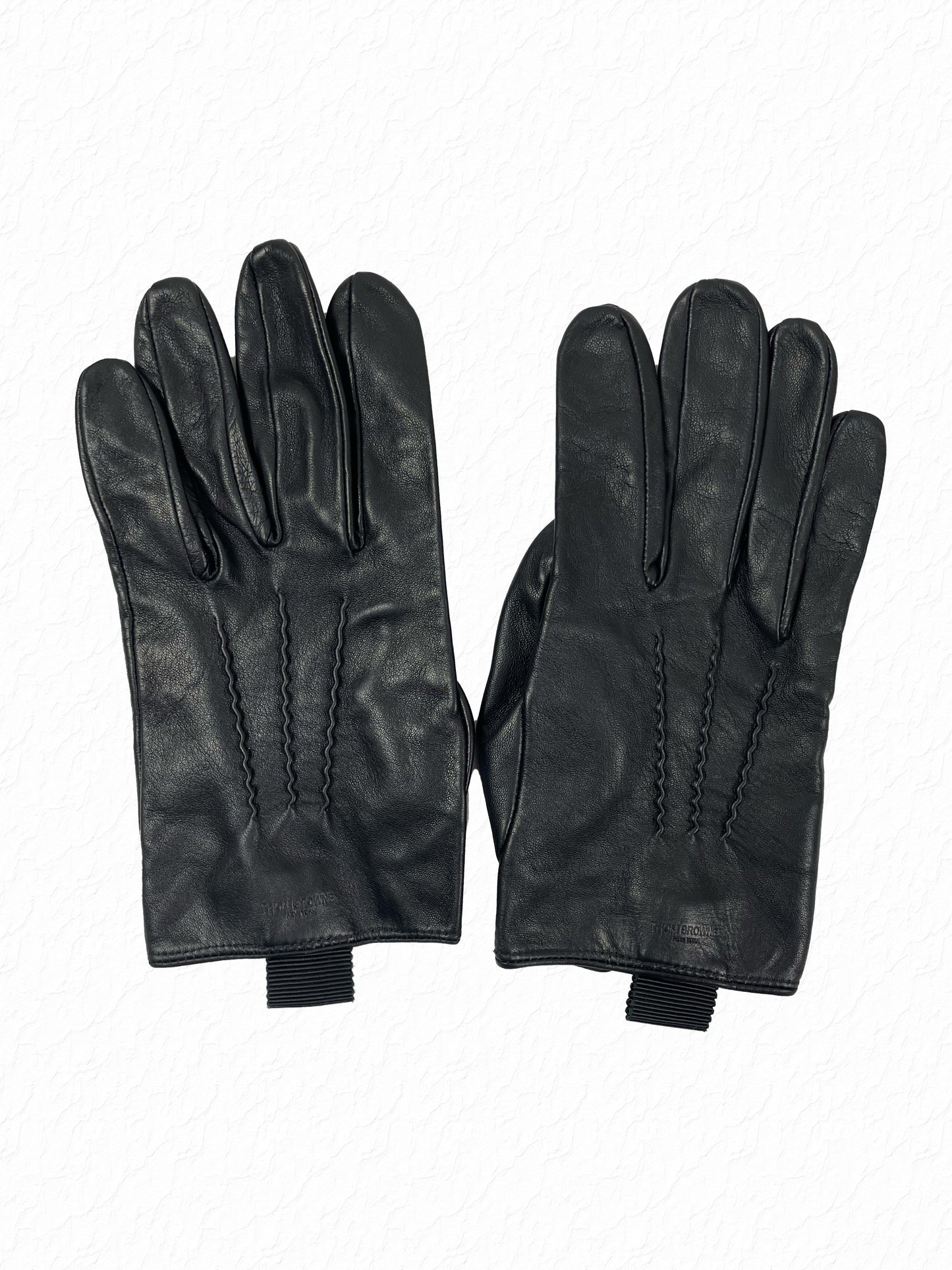 Ribbed grosgrain tab pull on Thom Browne leather gloves