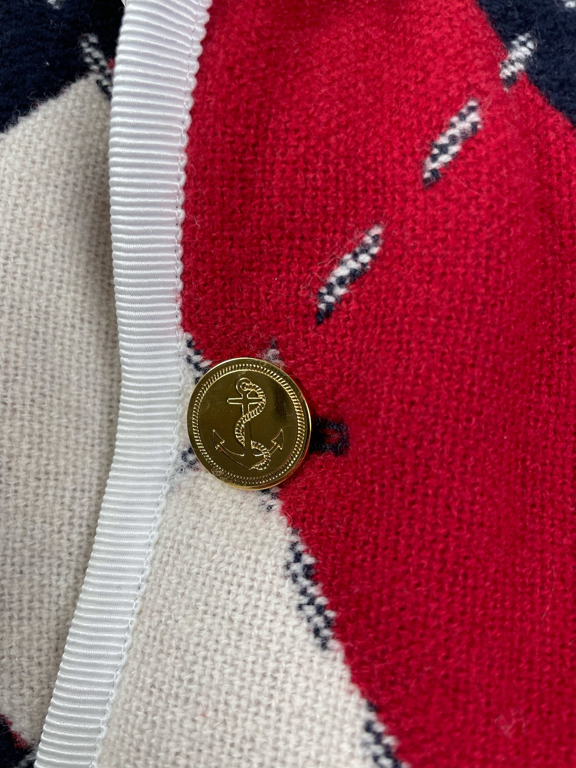 Signature tricolor striped lining inside Thom Browne argyle blazer