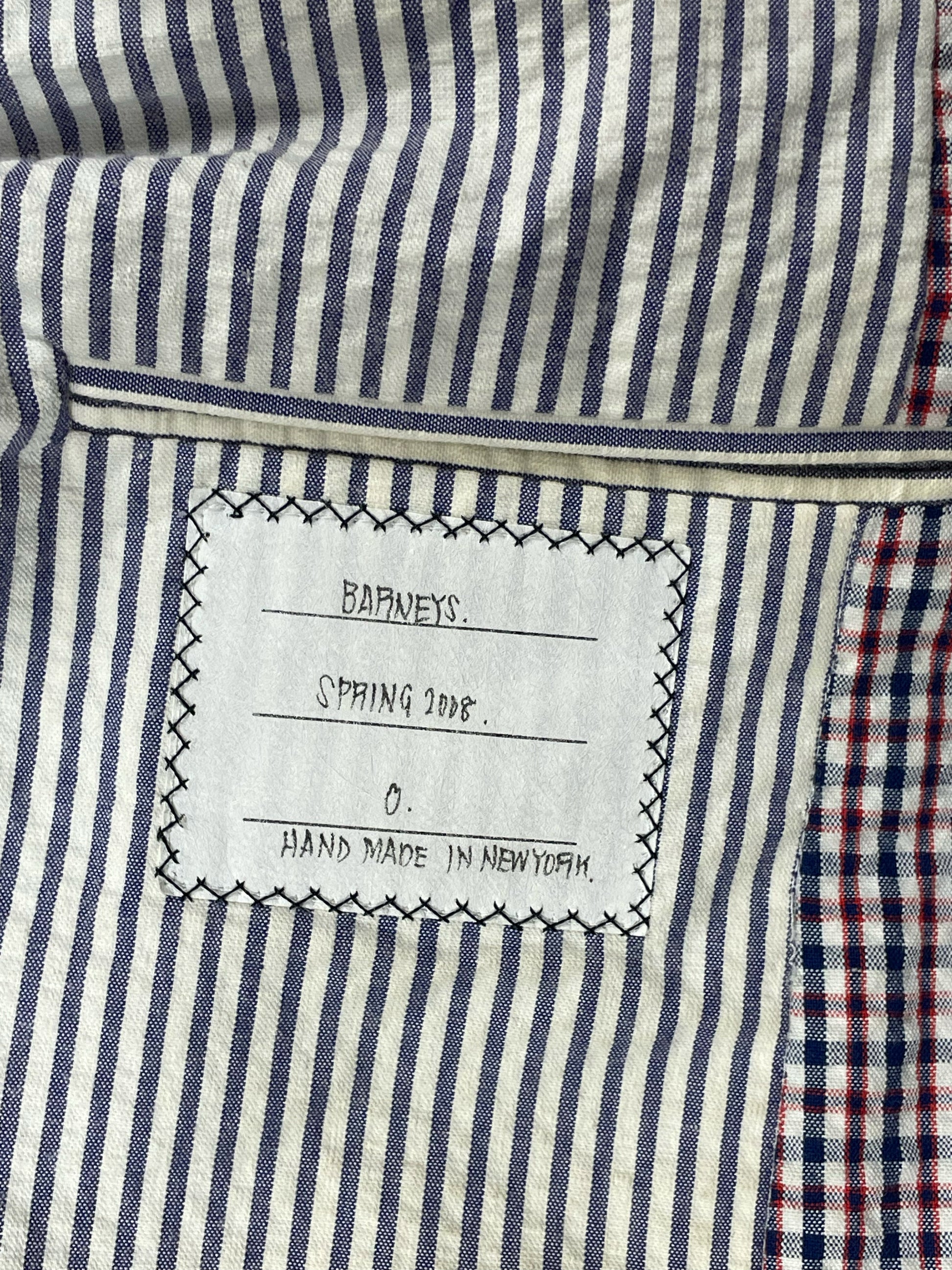 Blue and white striped lining inside Thom Browne archival gingham blazer