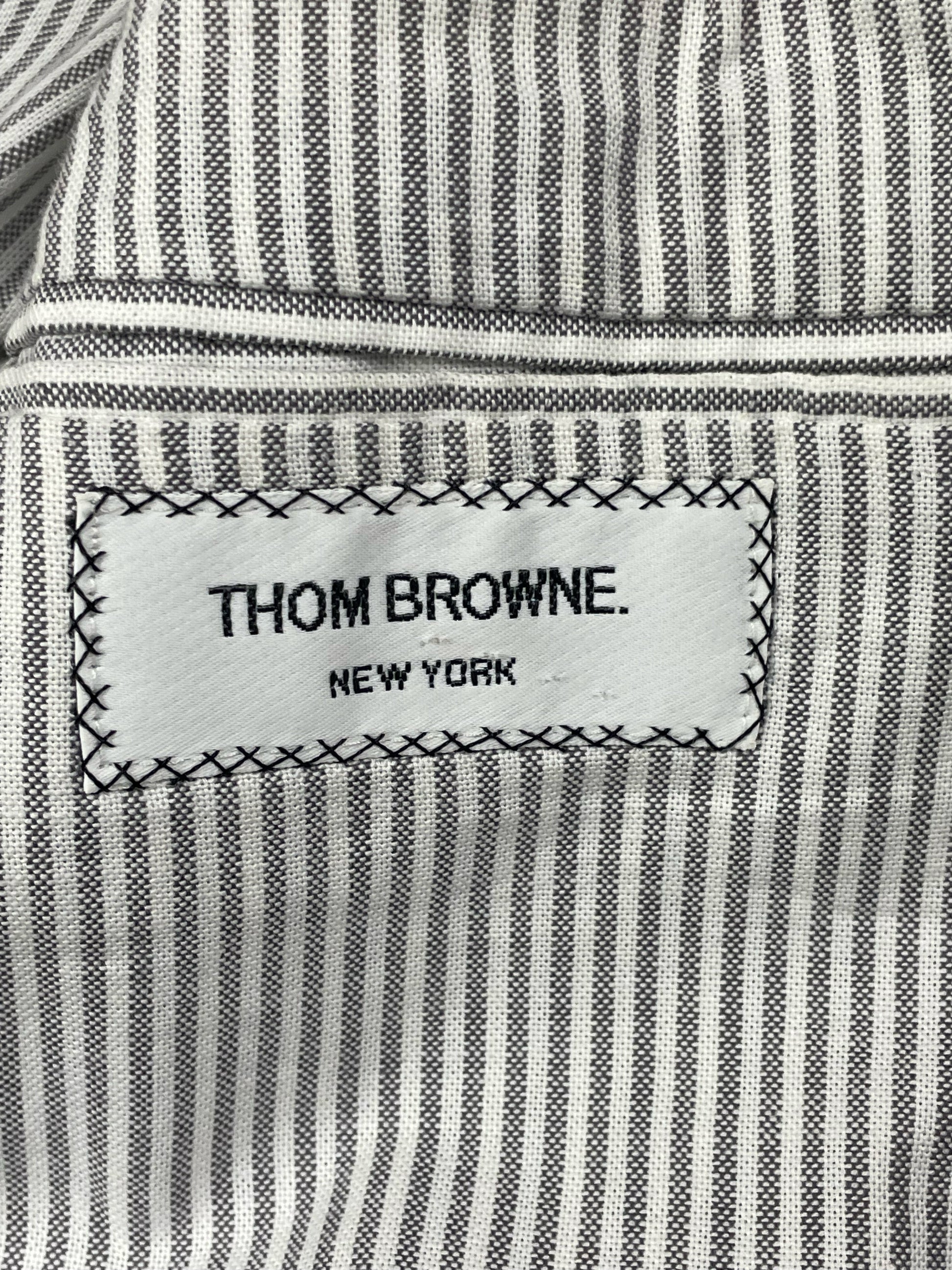 Thom Browne New York woven brand label on striped cotton lining