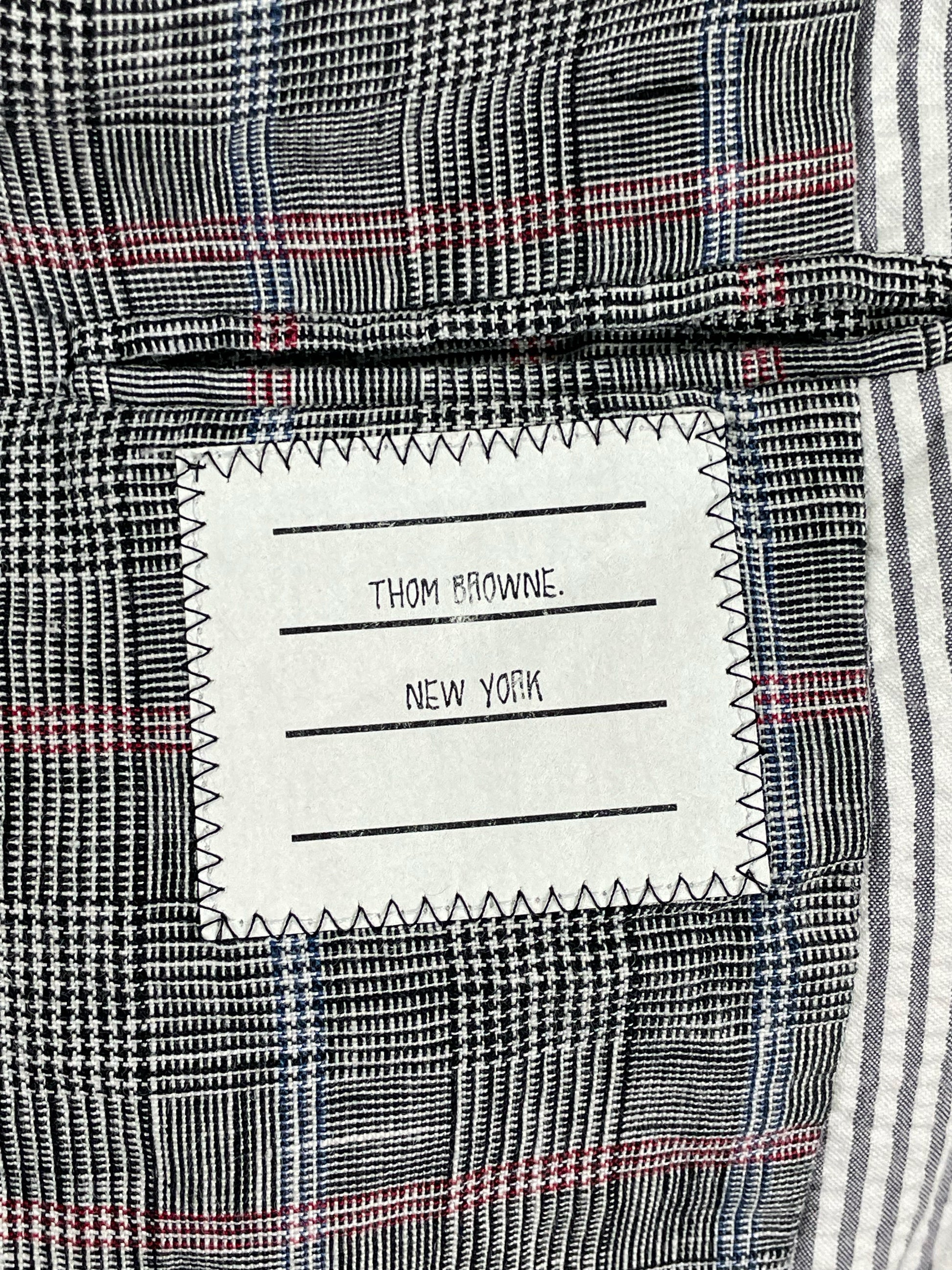Thom Browne New York woven label on Prince of Wales check lining