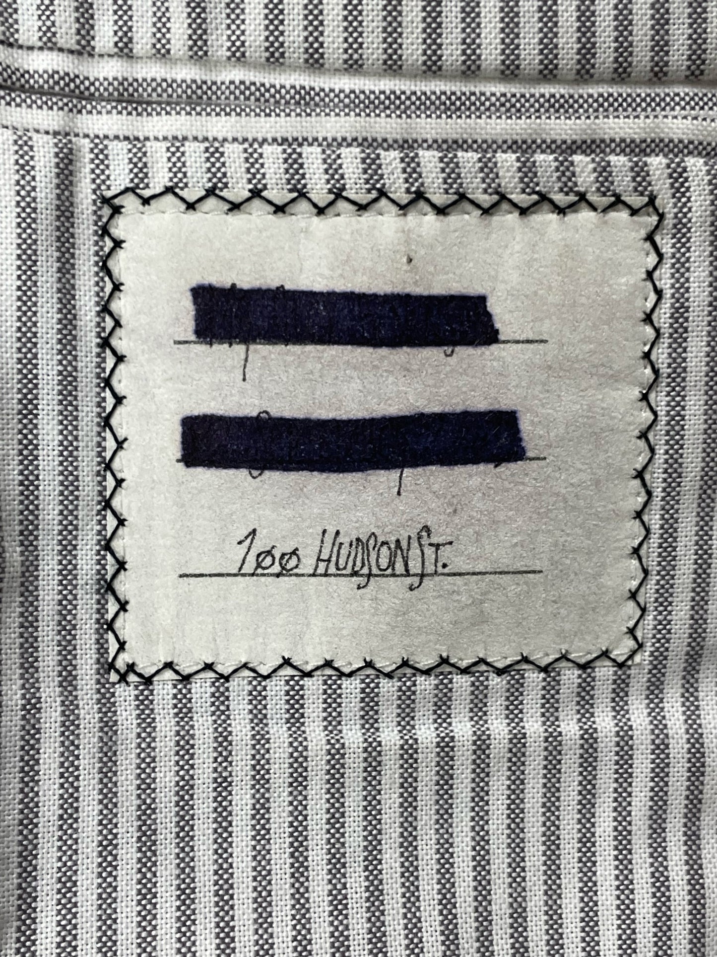 Striped grey cotton lining inside Thom Browne tweed sport coat