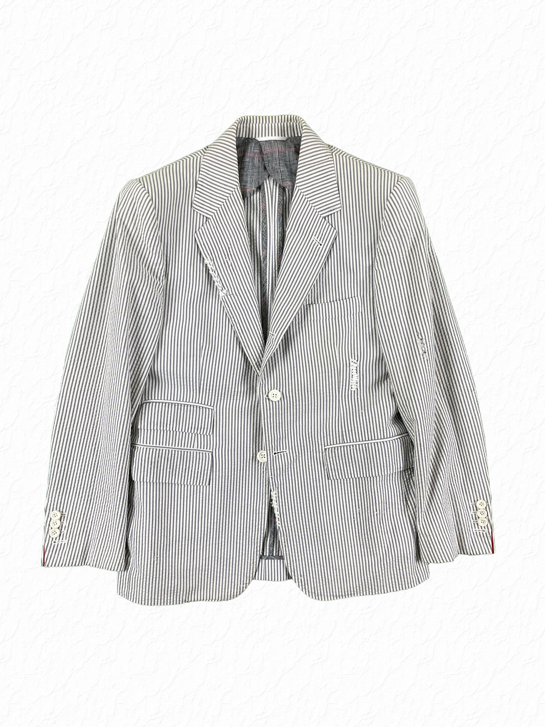 Thom Browne grey seersucker distressed sport coat with white rubber buttons