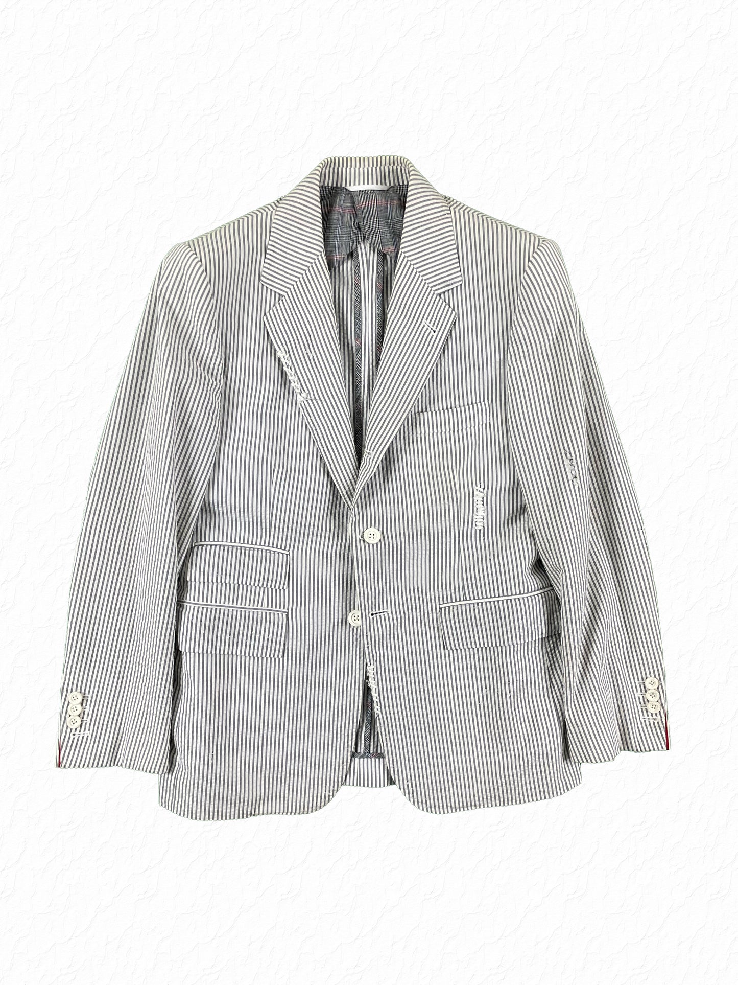 Thom Browne grey seersucker distressed sport coat with white rubber buttons