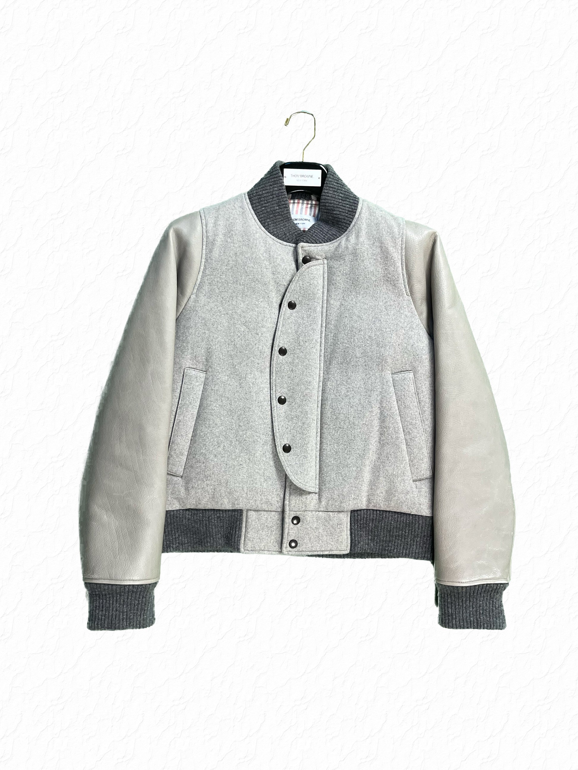 Grey Wool Flannel Letterman Jacket by Thom Browne with Leather Sleeves