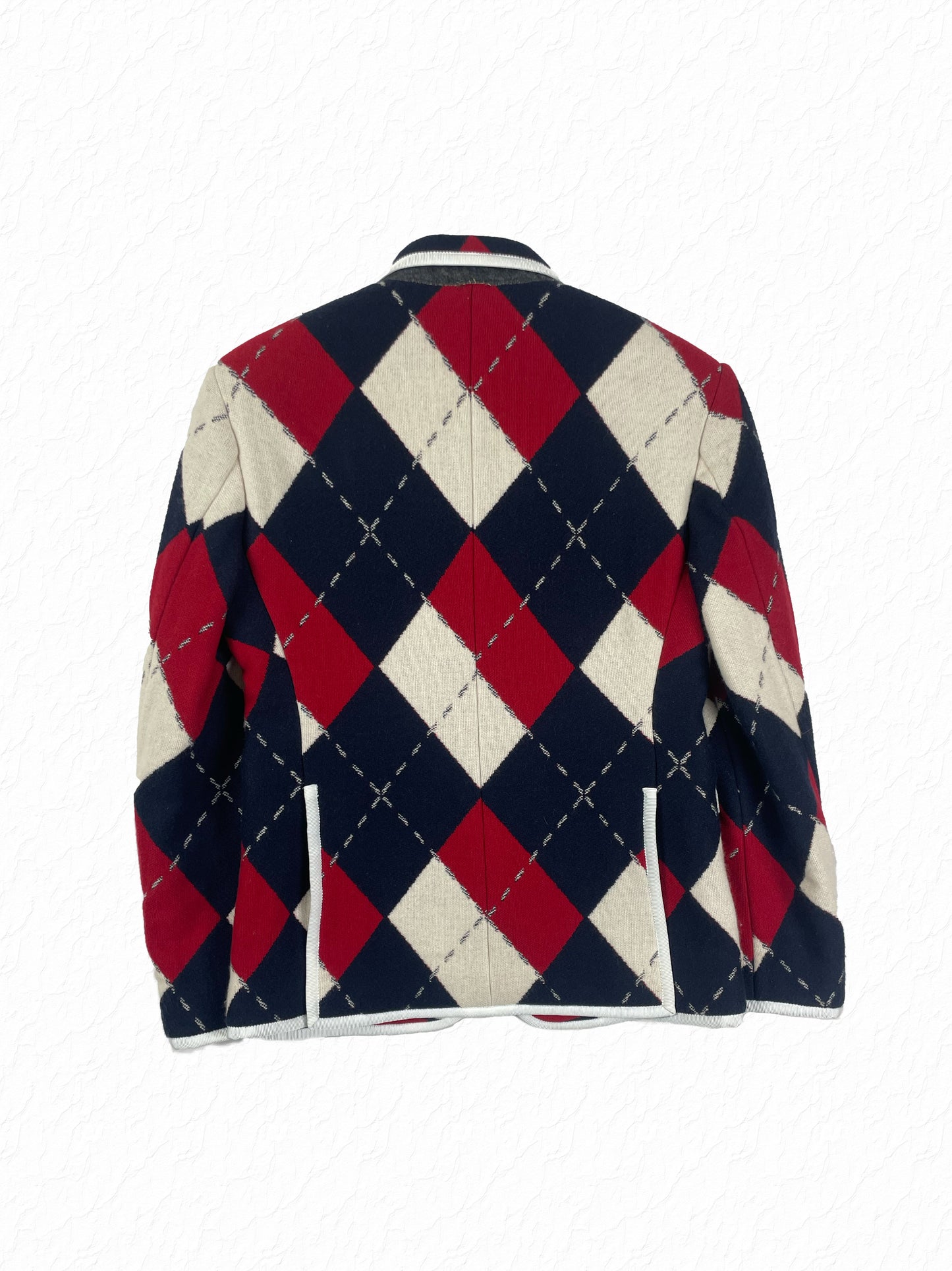 Gold anchor buttons on Thom Browne argyle blazer sleeve
