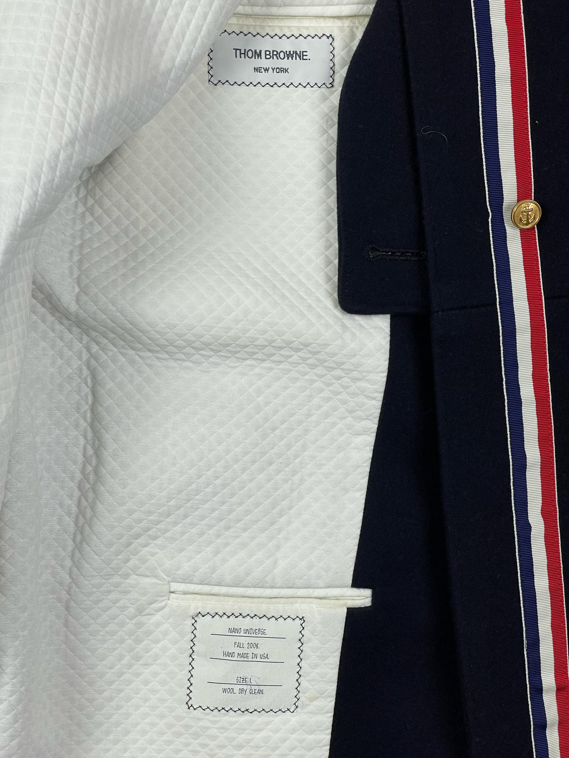Quilted white lining inside Thom Browne Fall 2008 navy wool overcoat