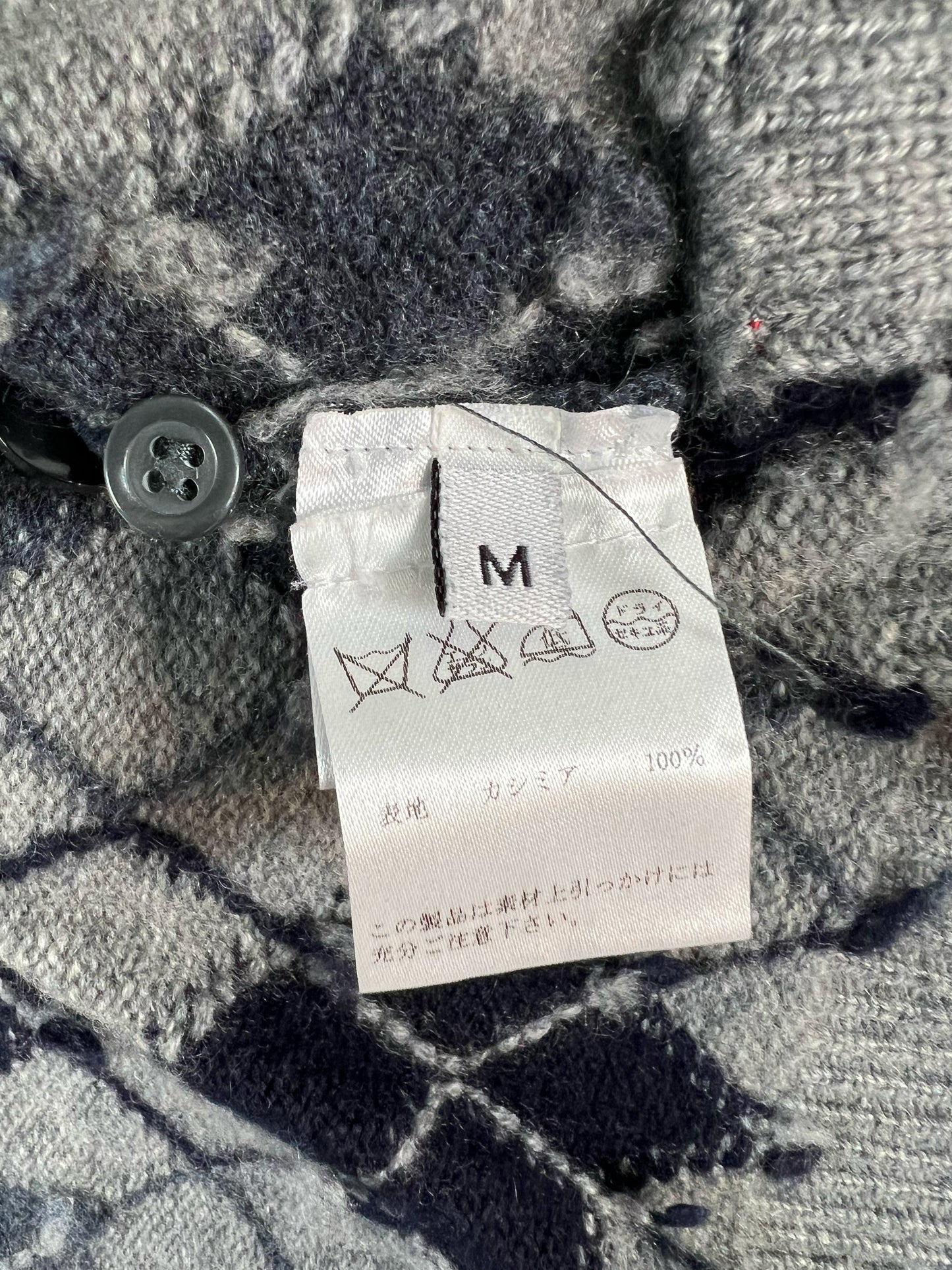 Signature 4-Bar stripe sleeve on grey Thom Browne argyle cardigan