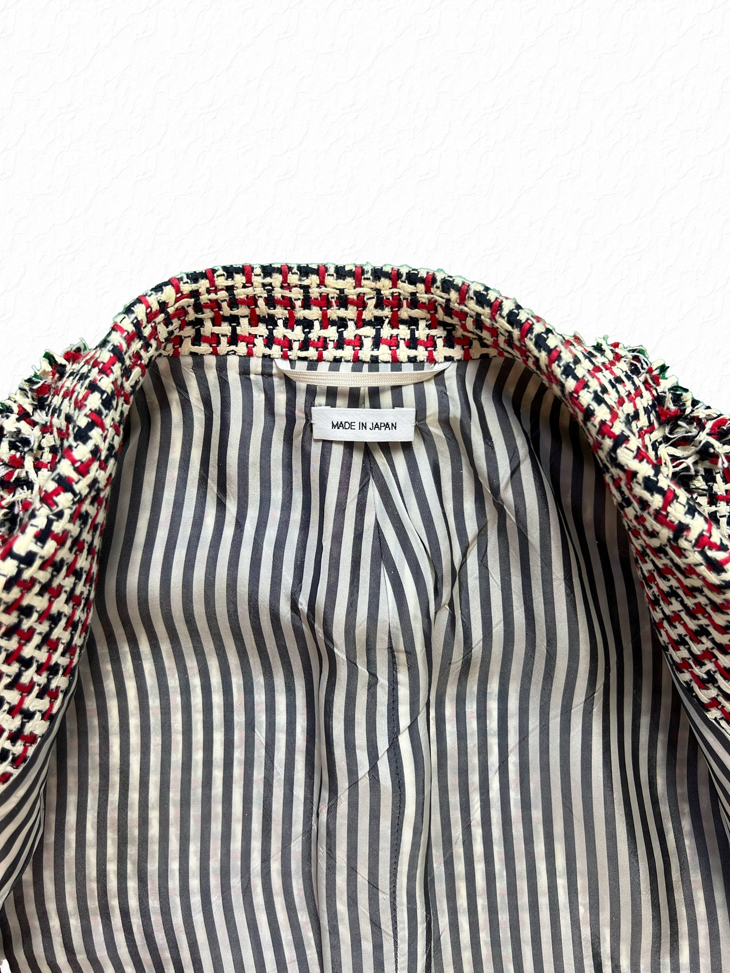 Grey grosgrain stripe lining inside Thom Browne RWB tweed jacket