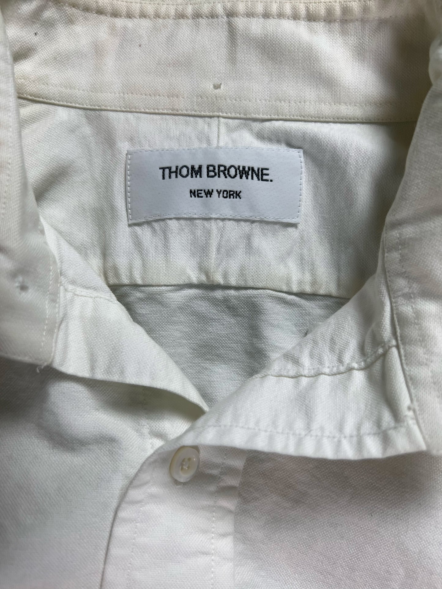 Thom Browne New York woven brand label on The Rail oxford shirt