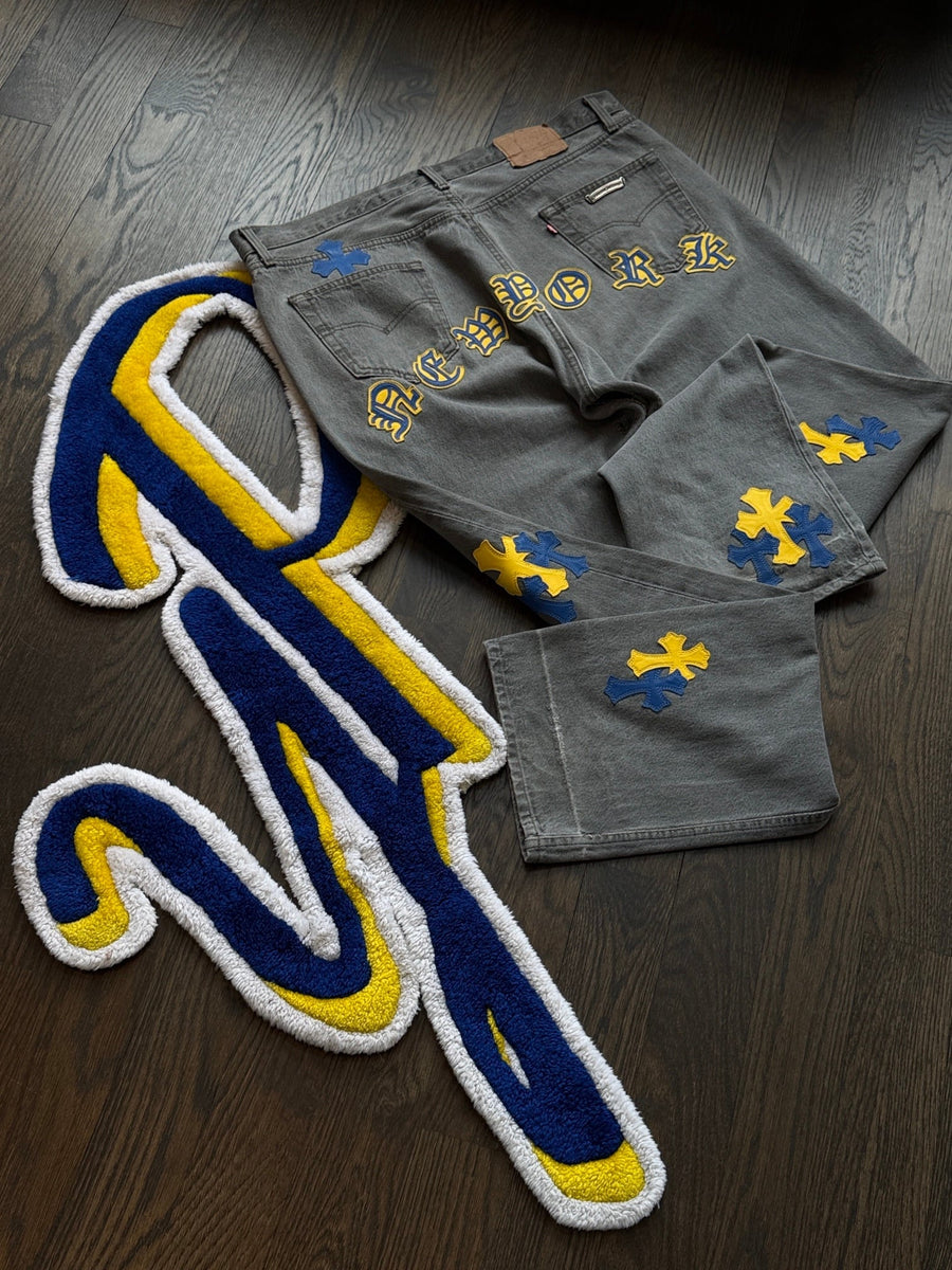 Chrome Hearts New York cross patch denim on the YP logo rug